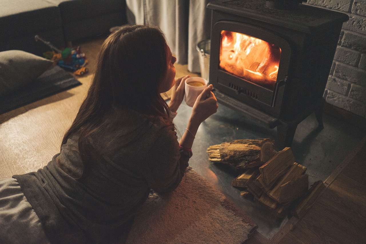 girl in front of fire place